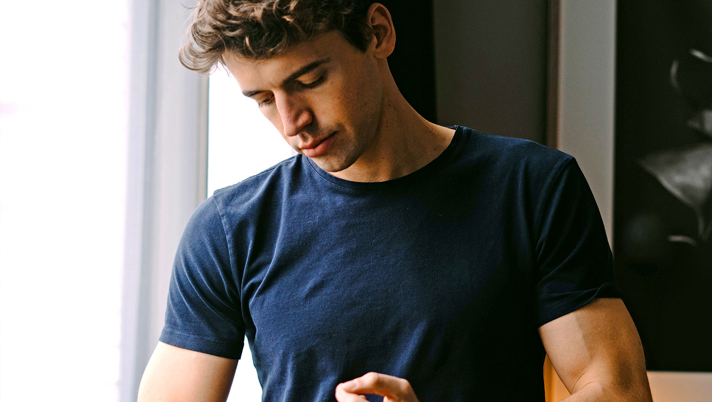 Man wearing dark blue shirt